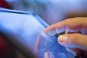 iPads now available @ NOLS Closeup picture of a finger touching an iPad